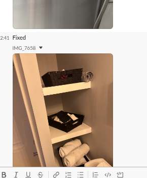 Slack post: shelving with folded towels, captioned 'Fixed'